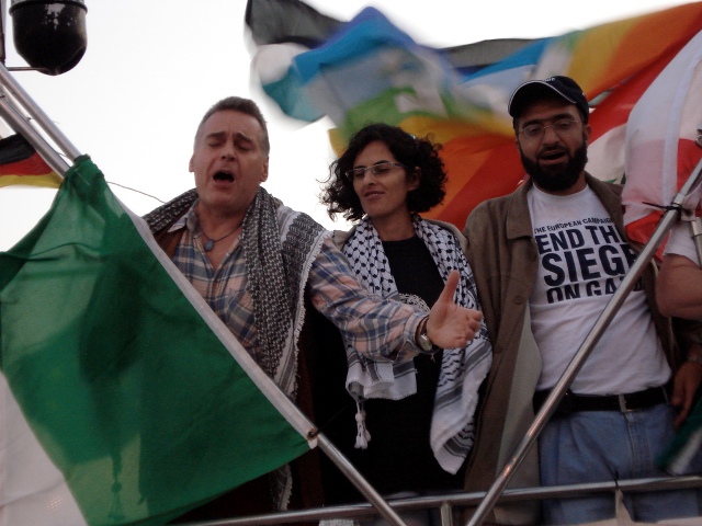 Italian Opera Singer Joe Fallisi, Free Gaza organizer Lubna Masrawa, and Palestinian activist Ghazi Abourashed, singing as they arrive in Gaza (October 2008)